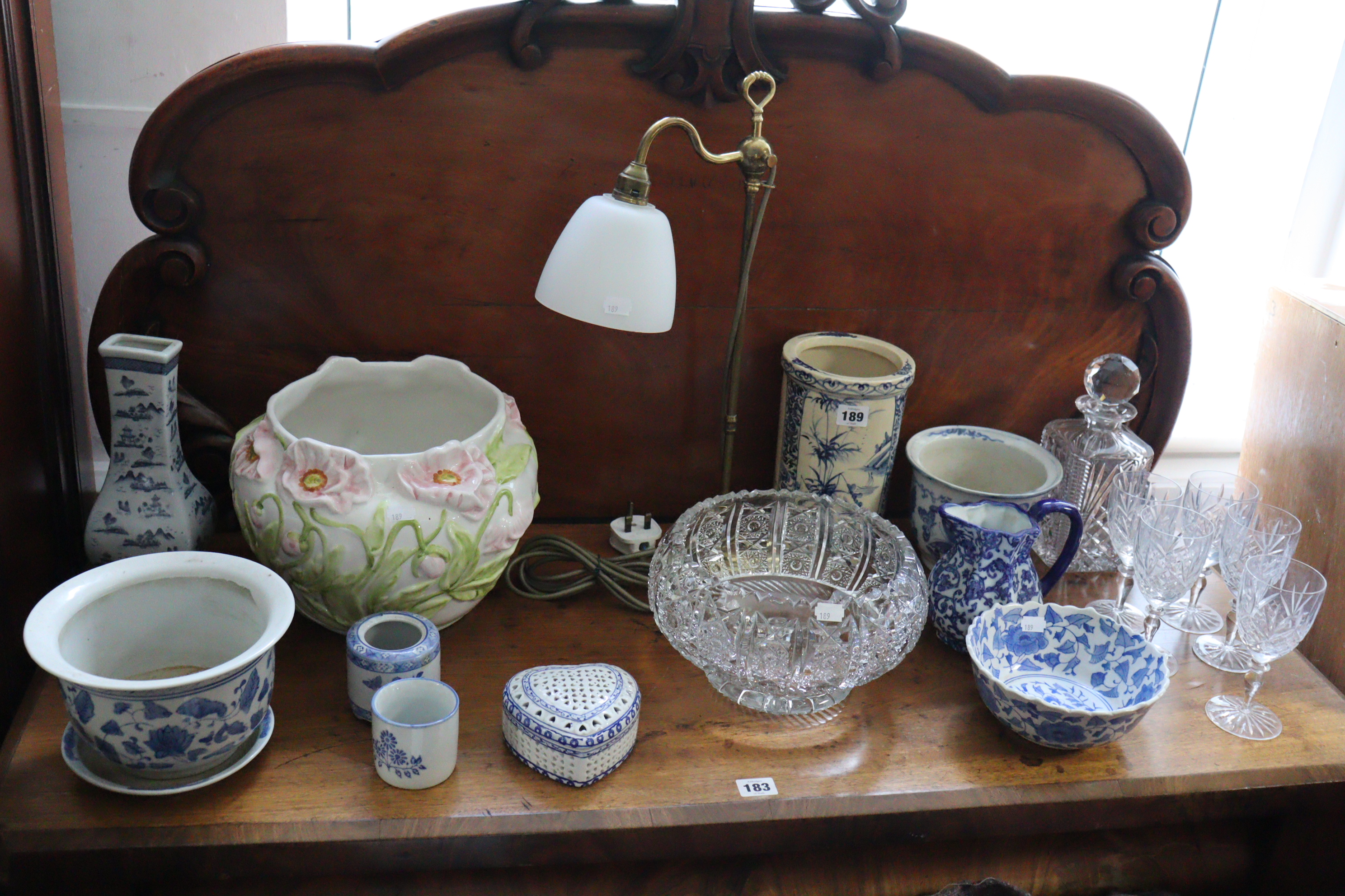 A heavy cut-glass decanter with a faceted ball stopper; a heavy cut-glass fruit bowl, various