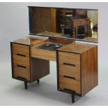 A mahogany & ebonised-finish knee-hole dressing table with a rectangular mirror to back, fitted with