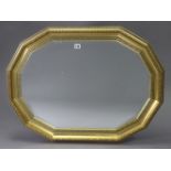 A gilt frame rectangular wall mirror with canted sides & inset bevelled plate, 34½” x 26”.