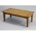A teak rectangular low coffee table on four square tapered legs, 51” wide x 18½” high x 25¾” deep.