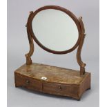 A late 19th century mahogany oval swing toilet glass fitted two drawers to the bow-front box base, &