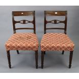 A pair of 19th century mahogany bow-back dining chairs with padded seats, & on ring-turned tapered