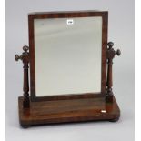 A 19th century mahogany rectangular swing toilet mirror with turned supports, & on a platform base