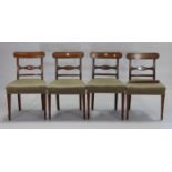 A set of four 19th century mahogany bow-back dining chairs with padded seats, & on square tapered