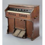 A vintage harmonium by Metzler & Co. of London in a walnut case, 41” wide x 37½” high.