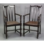A pair of mid-20th century oak rail-back carver dining chairs, with padded drop-in seats & on