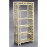 A cream painted cane & wicker tall standing five-tier open bookcase, 36” wide x 77½” high x 15½”