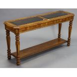 A walnut-finish rectangular two-tier side table inset two glass plates to the upper tier, & on