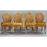 A set of eight continental-style beech dining chairs (including a pair of carvers) each inset with a