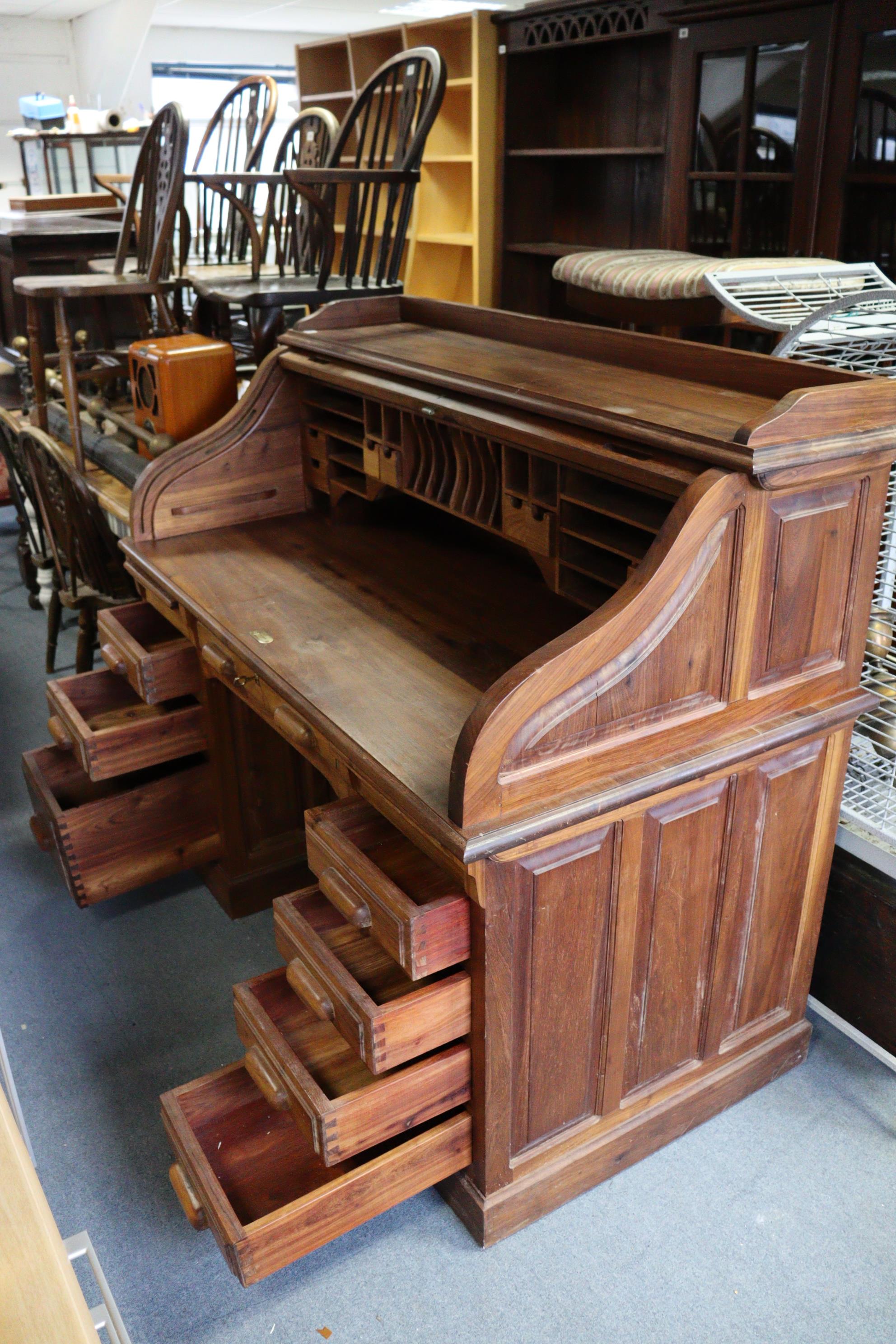 A teak roll-top desk with a fitted interior enclosed by a tambour shutter, & fitted four long - Image 2 of 3