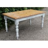 A natural & white painted pine kitchen table with moulded edge & rounded corners to the