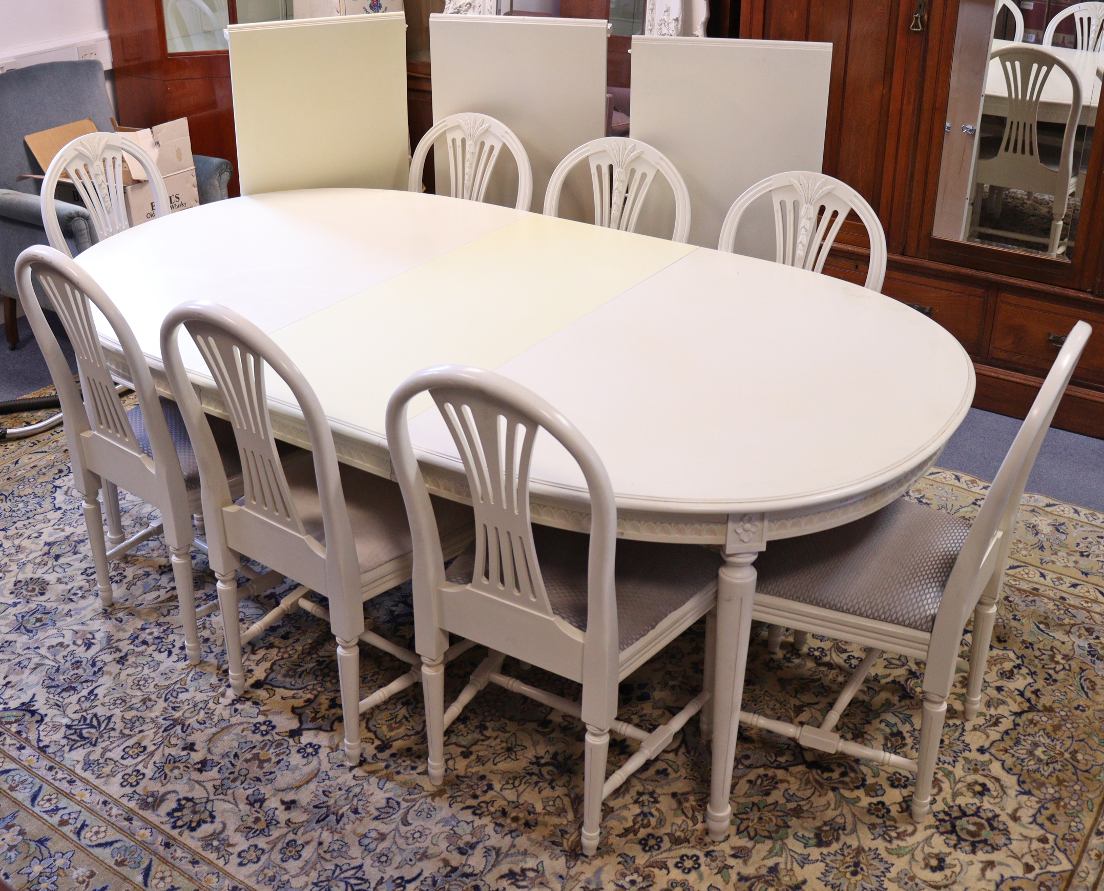 A GOOD QUALITY WHITE-FINISH EXTENDING DINING TABLE IN THE CONTINENTAL-STYLE with moulded edge to the - Image 2 of 10