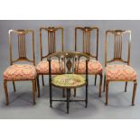 A set of four Edwardian beech splat-back dining chairs with sprung seats, & on square tapered