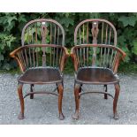 A pair of Windsor-style elbow chairs with splat & spindles to the hooped shaped backs, with hard