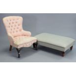 A Victorian-style buttoned-back easy chair upholstered pink & cream foliate material, & on short