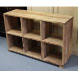 A teak dwarf standing open bookcase of six sections, 47” wide x 30¾” high x 14¼” deep.