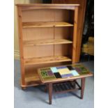 A pine four-tier standing open bookcase, on bun feet, 34” wide x 49” high; together with a pine