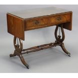 A regency-style inlaid-mahogany sofa table fitted two frieze drawers, & on lyre-shaped end