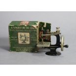 A vintage Singer girl’s sewing machine, boxed; & a plush teddy bear, 13” tall.