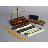 A mahogany brass beam scale to weigh 202, in a fitted mahogany case; together with a sovereign