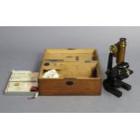 A vintage R & J Beck’s brass & black lacquered monocular microscope (No. 11993); with various