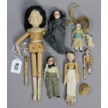 Three Victorian wooden peg dolls (various sizes); & four miniature dolls.