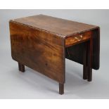 An 18th century mahogany rectangular drop-leaf dining table fitted with a frieze drawer to one end