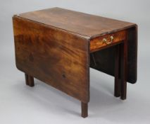 An 18th century mahogany rectangular drop-leaf dining table fitted with a frieze drawer to one end