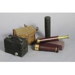 A vintage brass two-draw pocket telescope, 16¼” long, with travelling case; a “Super Seadog”