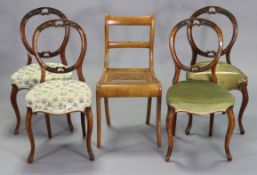 A set of four 19th century carved walnut balloon-back occasional chairs each with a padded seat, &
