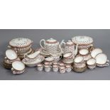 A Spode bone china “Fleur De Lys Red” extensive ninety-piece part dinner, tea, & coffee service.