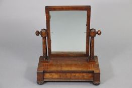 An early 19th century mahogany rectangular swing toilet mirror on tapered column supports &