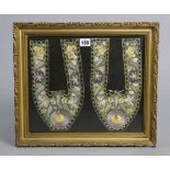 An embroidered floral panel in a glazed gilt frame, 11¼” x 13¼”; together with four various pipes.