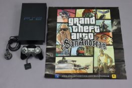 A Sony Playstation 2 games console, model No. SCPH-39003 with five various controllers & 60