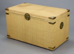A Chinese style woven-cane covered wooden blanket box with hinge lift-lid, brass mounts, & brass