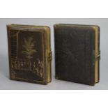 Two Victorian leather-bound carte-de-visite albums with illustrated pages.