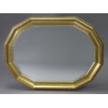 A gilt frame rectangular wall mirror with canted sides & inset bevelled plate, 34½” x 26”.