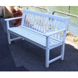 A white painted wooden slated garden bench on square legs, 59” long.