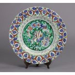 A 19th century Cantagalli pottery charger in the Iznik style, with brightly-coloured floral
