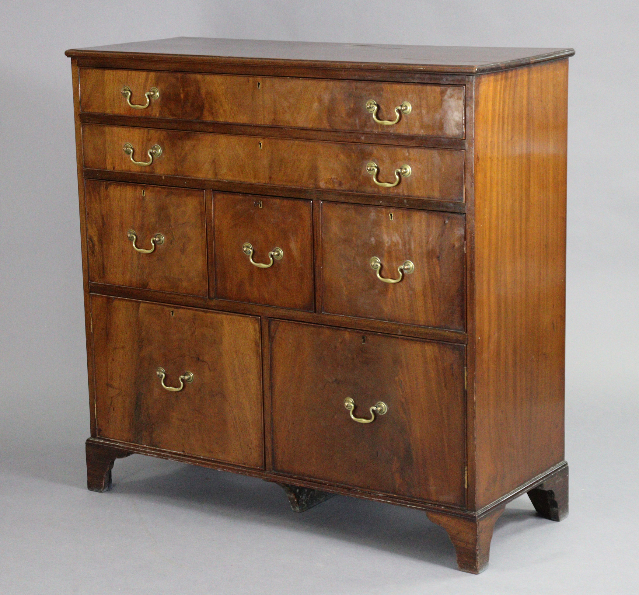 A 19th century mahogany chest, with moulded edge to the plain rectangular top, fitted with an