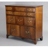 A 19th century mahogany chest, with moulded edge to the plain rectangular top, fitted with an