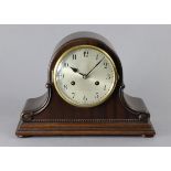 An early 20th century mantel clock in mahogany dome-top case with Arabic numerals, 8-day German
