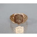 A 9ct. gold signet ring with engraved monogram; size: P; weight: 5.6 gm.