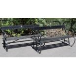 A pair of black painted wrought-iron & wooden slated garden benches (slight faults), 50” long.