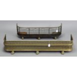 A vintage brass fender with a pierced frieze, & on lion-paw feet, 46¾” wide; & a vintage steel &