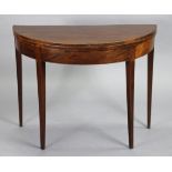 A mahogany demi-lune card table, the fold-over top lined with green baize , with plain frieze, on