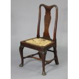 A 19th century solid oak dining chair, with splat-back & rush seat, on cabriole front legs with