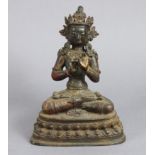 A Sino-Tibetan bronze model of a Boddhisattva, seated on double-lotus base, 9½” high.