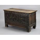 An 18th century oak cupboard (converted from a coffer), with hinged lift-lid above three small