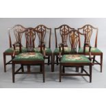 A set of eight mahogany dining chairs (including a pair of elbow chairs), with pierced splats to the